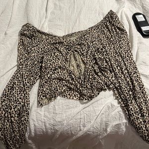 Size small cheetah print crop top. Long loose sleeves.